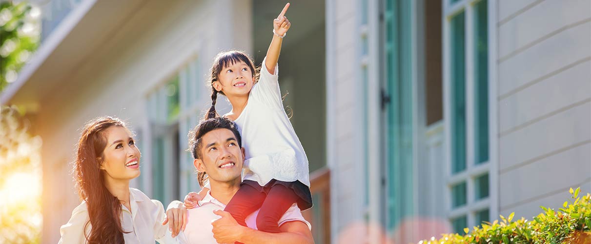 Happy Family Looking at Home